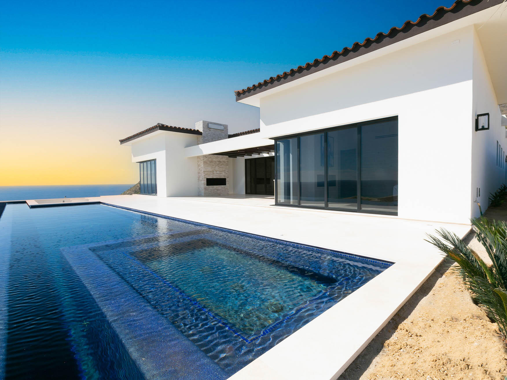 Cabo San Lucas Copala Lot 40 is a stunning two-story residence featuring dual primary suites on the upper level, offering expansive Pacific Ocean for sale