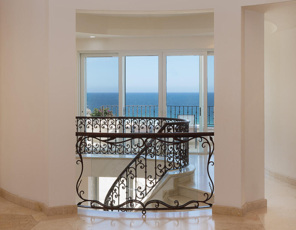 Cabo San Lucas Pedregal Csl Villa Marcella sits on an exquisite piece of ocean front property in the exclusive community of Pedregal in Cabo San Lucas. This 6 bedroom 9 bathroom beach estate has a very private location with it's natural mountainside to it's left that make it perfect for entertaining large beach parties, family gatherings, it has even been known to host quite a few a weddings. The beach estate consists of outdoor fire pit, Olympic size swimming pool, jacuzzi, outdoor cooking area, indoor game and bar room accessible from the beach. Enjoy the long beach walks and beautiful Pacific sunrises and sunsets from this beach home. Excellent INVESTMENT property or private home on the beach. for sale